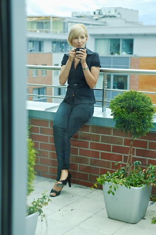 businesswoman calmly sipping coffee